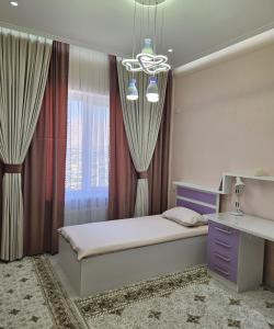 PENTHOUSE - HORIZON of KHUJAND客房内的一张或多张床位