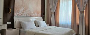 PENTHOUSE - HORIZON of KHUJAND客房内的一张或多张床位