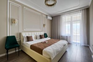 Ένα ή περισσότερα κρεβάτια σε δωμάτιο στο Five Business-class rooms in R-house near Mega Center Almaty