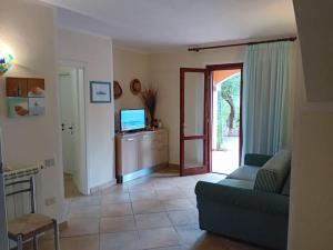 Μια τηλεόραση ή/και κέντρο ψυχαγωγίας στο Suite Sardinia -Appartamento indipendente a Tanaunella