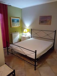 Ένα ή περισσότερα κρεβάτια σε δωμάτιο στο Suite Sardinia -Appartamento indipendente a Tanaunella