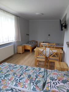 Postel nebo postele na pokoji v ubytování Noclegi u Franka