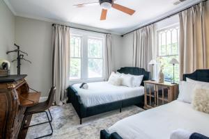 a bedroom with two beds and a piano at Spacious Highland Park Home, Family&pet Friendly in Birmingham