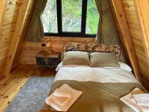 Postel nebo postele na pokoji v ubytování Mion Bungalov