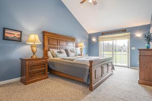 a bedroom with a bed and a dresser and a window at License to Chill in Swanton