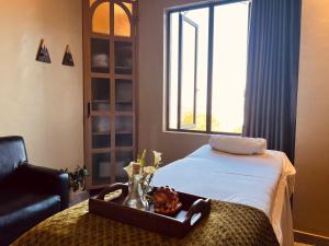 Ein Bett oder Betten in einem Zimmer der Unterkunft Urban Park Suites Hotel