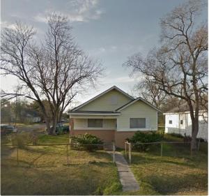 a house in a yard with trees and a driveway at 3 Bedroom Retreat with Modern Comforts and Local Charm in Port Arthur
