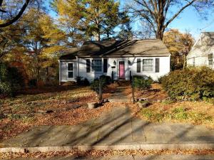 a white house with a red door at Charming Classic Cottage 2Br in Durham
