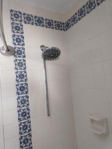 a shower with a shower head in a bathroom at Charming Classic Cottage 2Br in Durham +13 photos