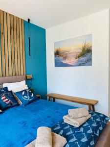 Postel nebo postele na pokoji v ubytování Hevenia Pogorzelica - Szum Morza Apartment-Sunny Side Baltic