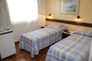 Cama ou camas em um quarto em Hotel São Bento
