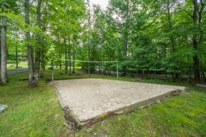 a volley ball hoop in a park with trees at Lake Dreaming in McHenry