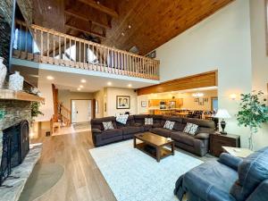 a living room with a couch and a fireplace at Lake Dreaming in McHenry