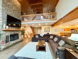 a living room with a couch and a fireplace at Lake Dreaming in McHenry +129 photos