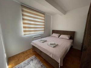 Ένα ή περισσότερα κρεβάτια σε δωμάτιο στο Apartman Ady 2