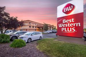 a sign for a best western plus parking lot at Best Western Plus Orchid Hotel & Suites in Roseville