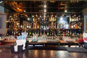 a bar with a lot of bottles of alcohol at Best Western La Vista Pathankot in Pathānkot