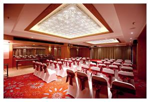 a conference room with chairs and a chandelier at Best Western Plus Tejvivaan in Visakhapatnam