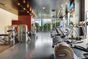 a gym with several treadmills and machines at Amazing Studio Infinity View Balcony in Hallandale Beach