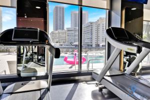 a gym with a view of a city at Amazing Studio Infinity View Balcony in Hallandale Beach