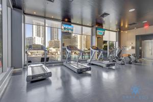 a gym with several cardio equipment in a building at Amazing Studio Infinity View Balcony in Hallandale Beach