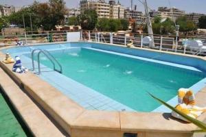 a large swimming pool on a cruise ship at نايل كروز المعادي in Cairo