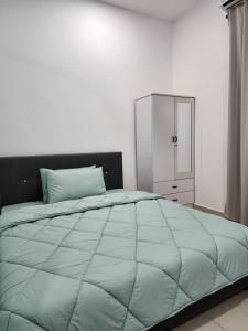 Postel nebo postele na pokoji v ubytování Homestay Warisan Iman