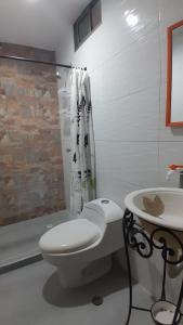 Koupelna v ubytování Tolú mágico, apartamentos amoblados con vista al mar, Elegancia y comodidad