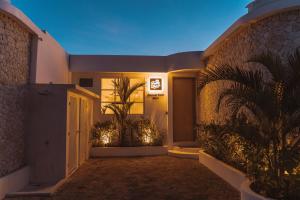 a hallway of a house with a door with lights at Sonnys Uluwatu in Uluwatu