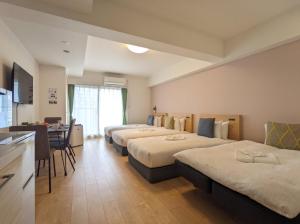 Postel nebo postele na pokoji v ubytování ESLEAD HOTEL Namba South Ⅰ