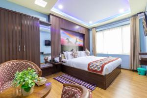 En eller flere senger på et rom på Siddhartha Hotel Grand City