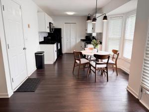 a kitchen and dining room with a table and chairs at Aesthetic Home Near Ft Campbell in Clarksville