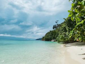a beach in the philippines on a cloudy day at Charming Lipe Beach Resort in Ko Lipe