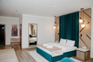 a bedroom with a bed and a room with a mirror at Forest Camp in Shchūchīnsk +26 photos