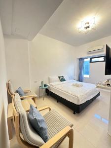Postel nebo postele na pokoji v ubytování Elk Kitten Homestay