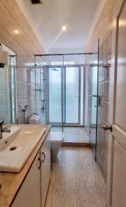 a bathroom with a sink and a toilet and a shower at Villa - Biệt Thự Nghỉ Dưỡng Nha Trang in Nha Trang +6 photos