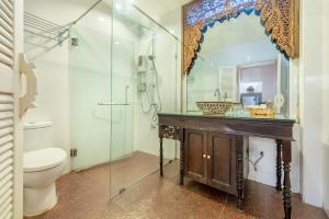 a bathroom with a toilet and a sink and a mirror at SHIN Hotel Chiangmai Gate in Chiang Mai +38 photos