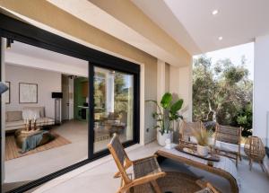 an open living room with a large glass window at Contessa Suites in Lefkada