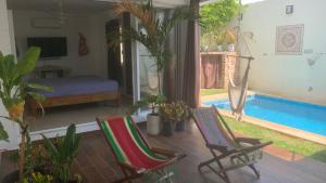 a room with two chairs and a swimming pool at Casa Intensamente in Jesús María +10 photos
