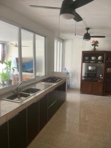 a kitchen with a sink and a counter top at Casa Intensamente in Jesús María