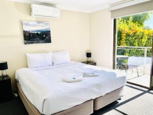 Postel nebo postele na pokoji v ubytování Huskisson Beach Escape