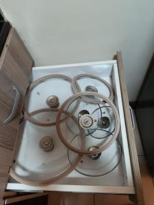 a glass table with a bunch of wires on it at Zoe Homes Westpointe Suites 1 and 2 bedroom Nairobi West Estate Mbagathi Way Madaraka Estate Strathmore University in Nairobi