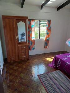 Postel nebo postele na pokoji v ubytování Tovuka House Scuba too