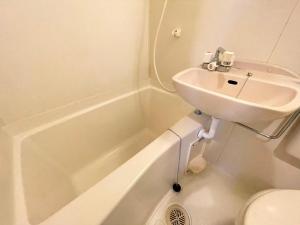a bathroom with a sink and a toilet and a tub at シャンテ高田馬場22 in Tokyo +21 photos