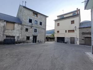 an empty street in an old stone building at CASA MELCHOR II Villanúa in Villanúa