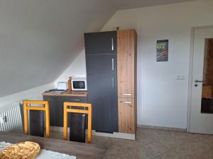 Kuchyň nebo kuchyňský kout v ubytování Bergblick-FeWo + 5 fotografií