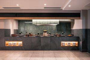 a kitchen with a counter with food on it at Stella Palace Aqua Park Resort in Hersonissos
