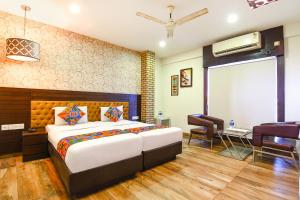 Un pat sau paturi într-o cameră la FabHotel Prime Goodwill