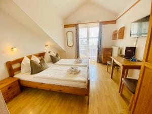 Postel nebo postele na pokoji v ubytování Restaurant - Café - Pension HASSLER
