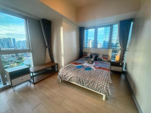 EG Private House -BGC UPTOWN客房内的一张或多张床位